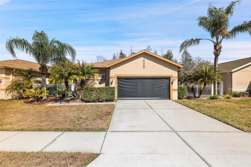 PRIVACY ON CONSERVATION THIS 3 BED/2BATH/2 CAR GARAGE *WITH GOLF - Beach Home for sale in Land O Lakes, Florida on Beachhouse.com