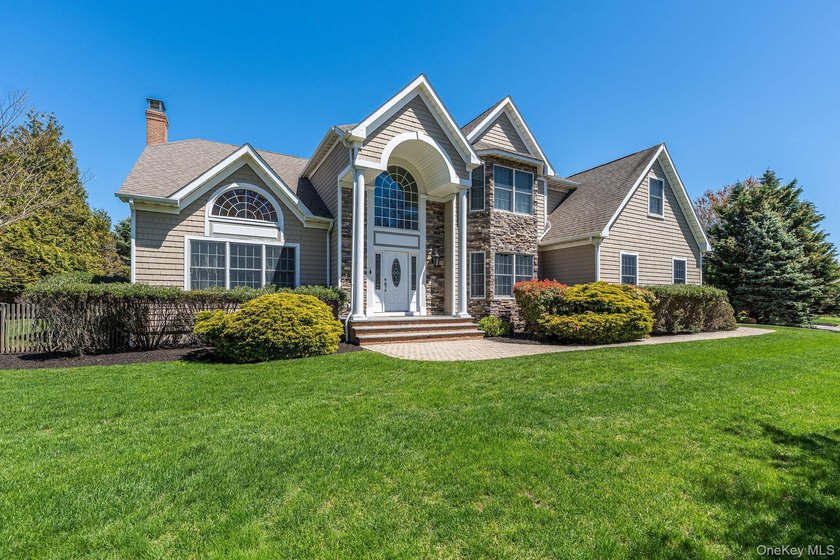 Located in coveted Rock Cove Estates in Greenport, this - Beach Home for sale in Greenport, New York on Beachhouse.com