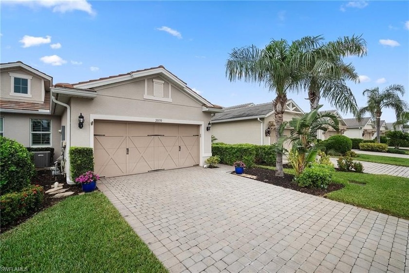 THIS BEAUTIFUL LAKEFRONT VILLA IS IN A GREAT LOCATION IN ESTERO - Beach Home for sale in Estero, Florida on Beachhouse.com