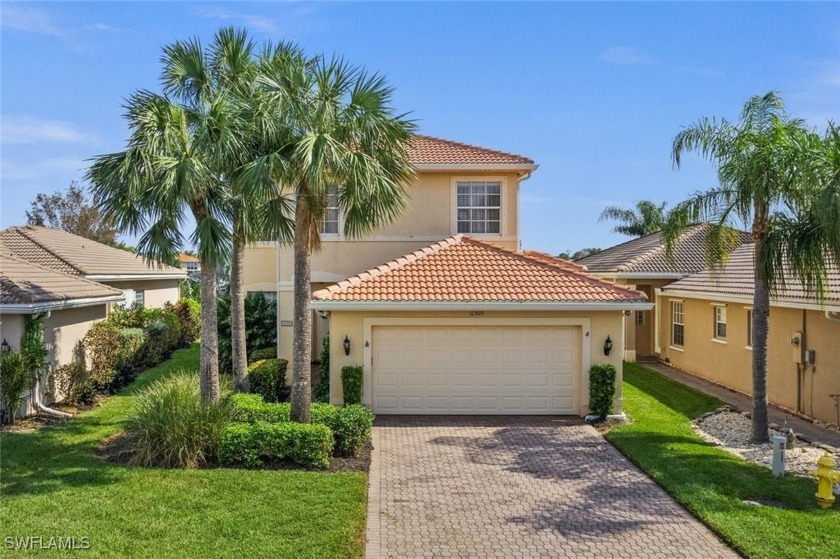 Pool home with a lake view in Botanica Lakes, a gated community - Beach Home for sale in Fort Myers, Florida on Beachhouse.com