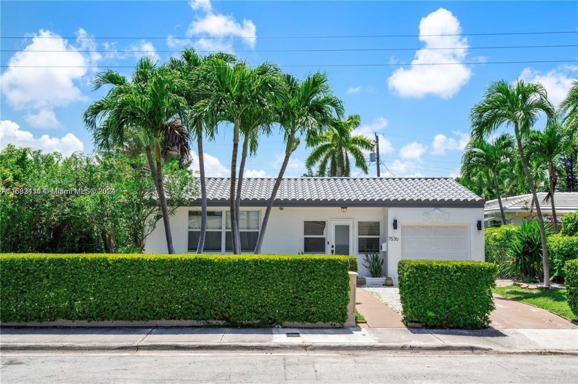 A TRUE TREASURE ON TREASURE ISLAND. FLOODED WITH LIGHT AND CHARM - Beach Home for sale in North Bay Village, Florida on Beachhouse.com