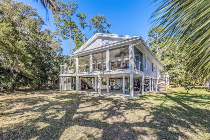 Tucked away in Ochlockonee Bay with a deep-water dock and a 13 - Beach Home for sale in Panacea, Florida on Beachhouse.com