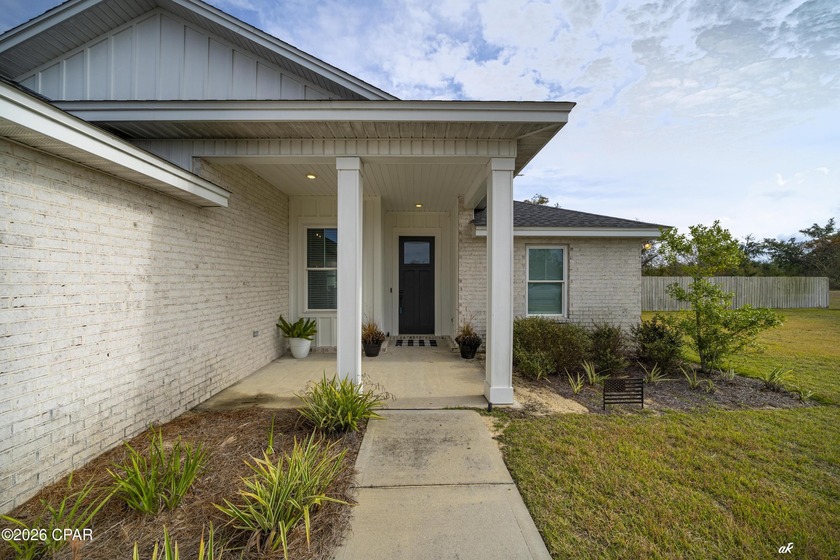 This beautifully crafted 5-bedroom, 2-bathroom home offers - Beach Home for sale in Lynn Haven, Florida on Beachhouse.com