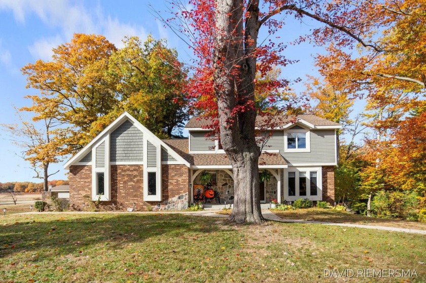 Discover 18791 West Spring Lake Rd! This standout residence, in - Beach Home for sale in Spring Lake, Michigan on Beachhouse.com