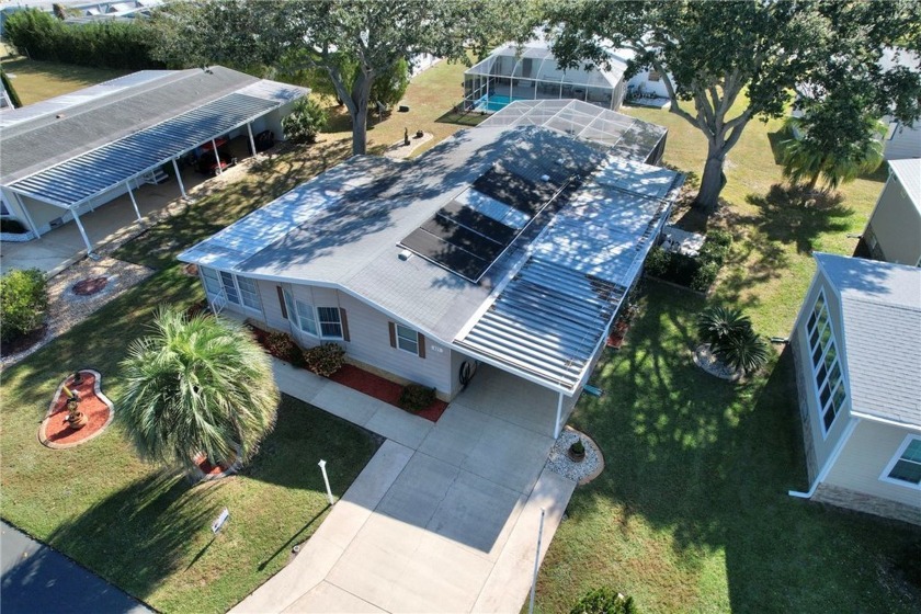 COME HOME TO BAREFOOT BAY.....This 2 bedroom 2 bath pool home is - Beach Home for sale in Barefoot Bay, Florida on Beachhouse.com