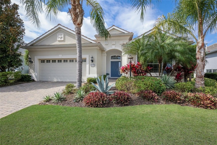 Beautifully maintained three-bedroom residence with a dedicated - Beach Home for sale in Lakewood Ranch, Florida on Beachhouse.com