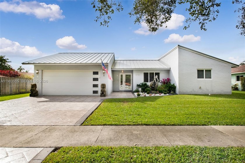 Welcome to this stunning lakefront home in the highly - Beach Home for sale in Cooper City, Florida on Beachhouse.com