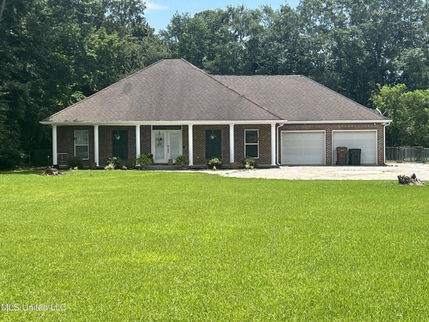 Discover the charm of this timeless 3-bedroom, 2-bathroom brick - Beach Home for sale in Long Beach, Mississippi on Beachhouse.com