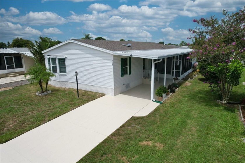 This furnished 1995 model home boasts three bedrooms and two - Beach Home for sale in Barefoot Bay, Florida on Beachhouse.com