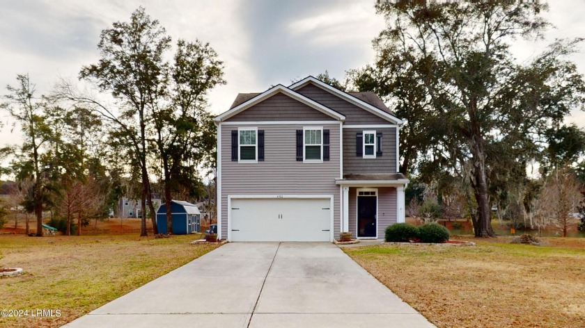 Nestled in a serene neighborhood on a 1/4 acre lot, this - Beach Home for sale in Beaufort, South Carolina on Beachhouse.com