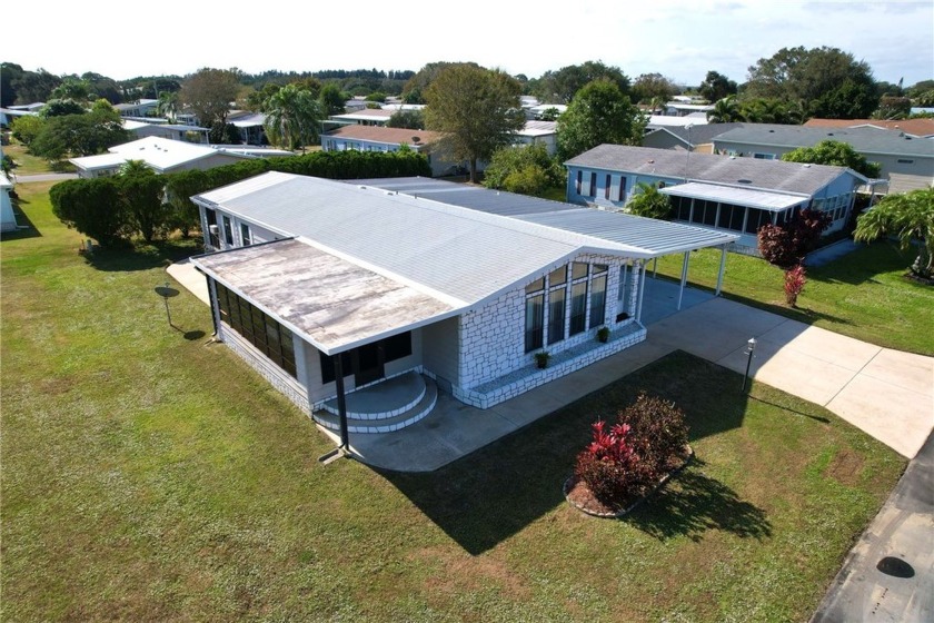 Located in the heart of Barefoot Bay, this cute coastal home - Beach Home for sale in Barefoot Bay, Florida on Beachhouse.com