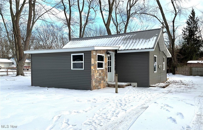 Tucked away on a nearly one-acre lot, this fully updated - Beach Home for sale in Madison, Ohio on Beachhouse.com