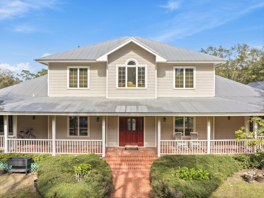 This stunning two-story home is set on a private 7-acre property - Beach Home for sale in Fort Pierce, Florida on Beachhouse.com