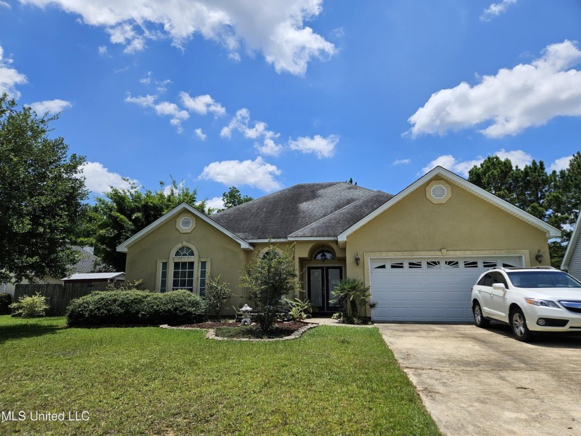 Beautiful custom built home welcomes you with lovely landscaping - Beach Home for sale in Biloxi, Mississippi on Beachhouse.com