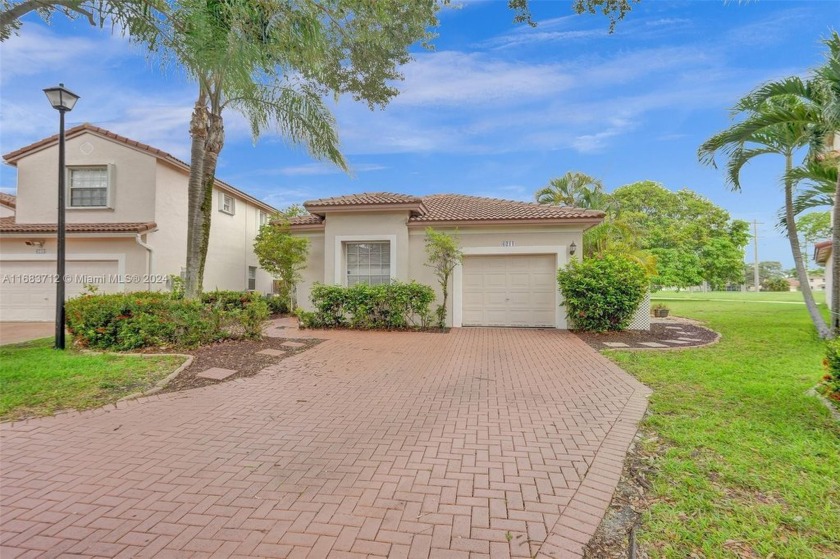 Discover modern living in this beautifully renovated 3-bedroom - Beach Home for sale in Coral Springs, Florida on Beachhouse.com