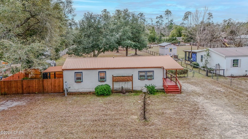 Tucked away on nearly 0.7 acres in Southport, this adorable - Beach Home for sale in Panama City, Florida on Beachhouse.com