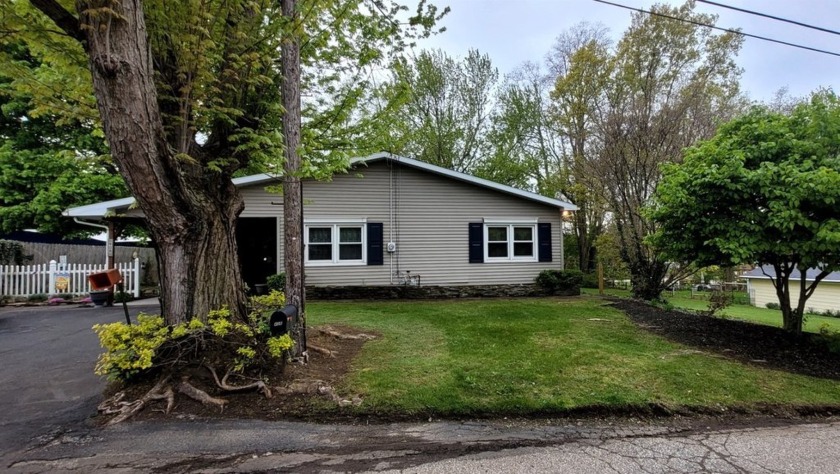 Charming Ranch! Step into the sunroom w/woodstove, leading into - Beach Home for sale in Erie, Pennsylvania on Beachhouse.com