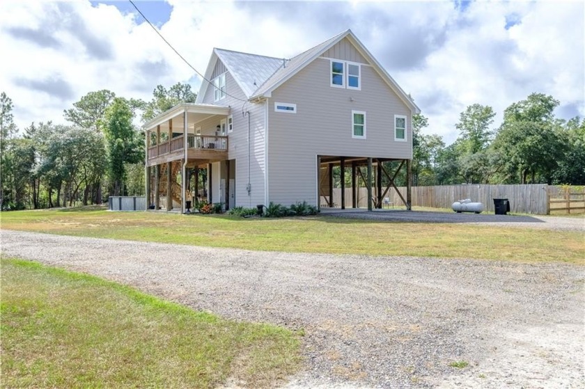 Discover this stunning home built in 2021, featuring - Beach Home for sale in Theodore, Alabama on Beachhouse.com