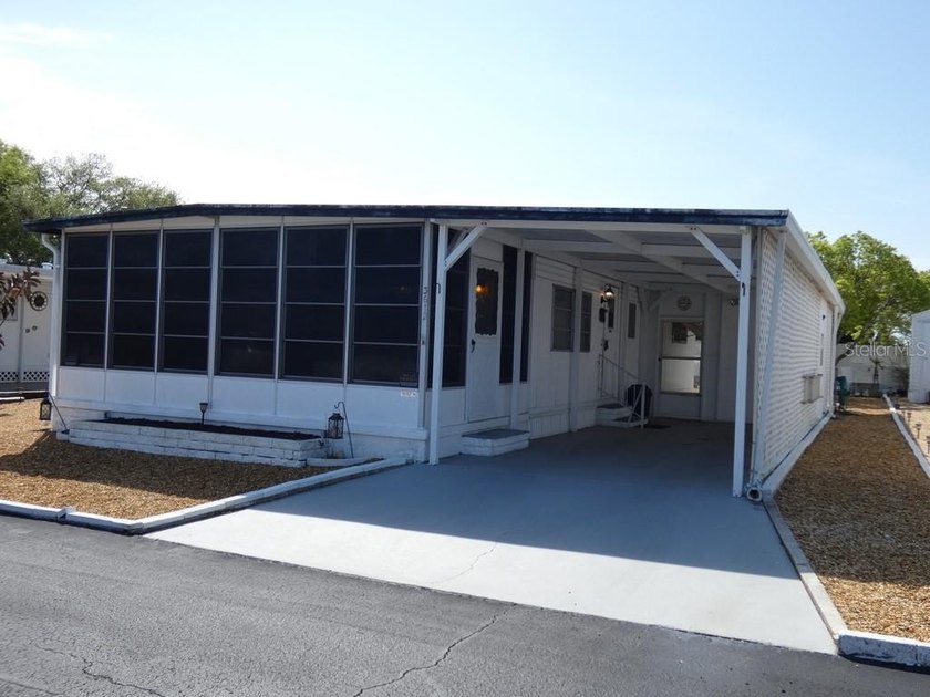 This 2 bedroom, 2 bathroom home located in Tiki Village MHP - Beach Condo for sale in Holiday, Florida on Beachhouse.com