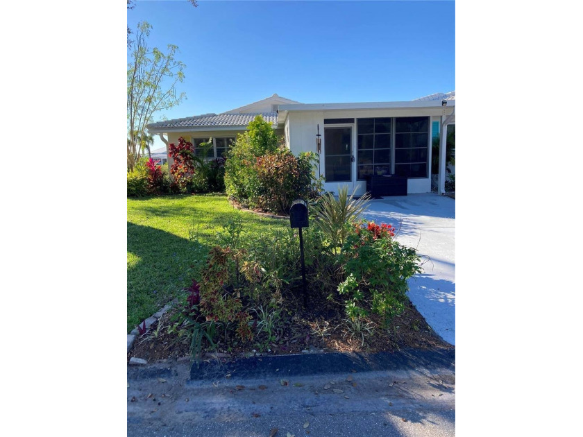 Discover this beautifully updated, fully furnished home nestled - Beach Home for sale in Nokomis, Florida on Beachhouse.com