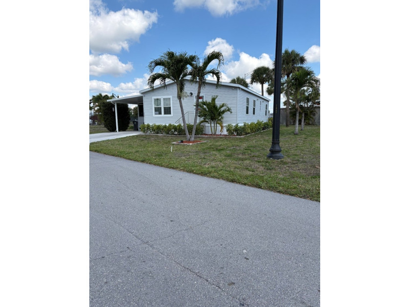 Stunning 3-Bed, 2-Bath Mobile Home in 55+ Gated Community - Beach Home for sale in Riviera Beach, Florida on Beachhouse.com