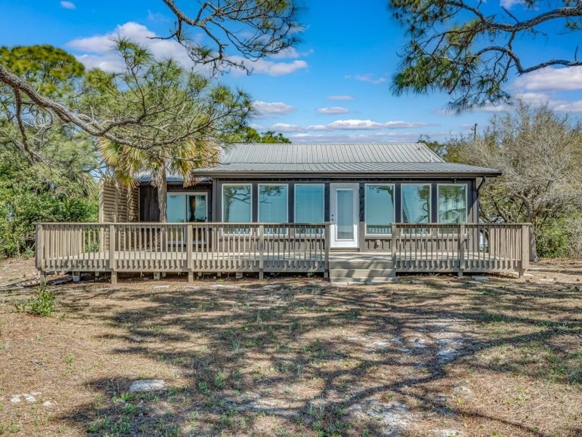 Welcome to 1493 Alligator Drive, a truly exceptional Gulf-front - Beach Home for sale in Alligator Point, Florida on Beachhouse.com