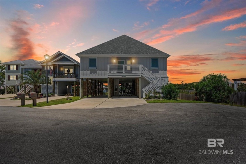 WATER FRONT LIVING DIRECTLY ON BON SECOUR RIVER! Custom built - Beach Home for sale in Gulf Shores, Alabama on Beachhouse.com