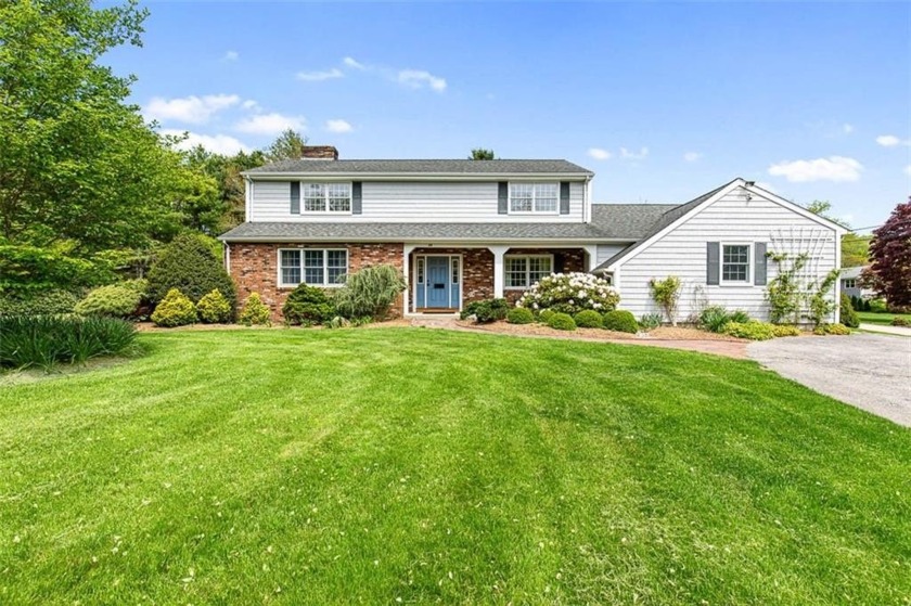 Set on a beautifully landscaped, 1.25-acre corner lot, this - Beach Home for sale in Westerly, Rhode Island on Beachhouse.com