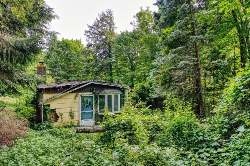 Tucked away on a secluded 1.15 acre lot in the desirable - Beach Home for sale in Fairview, Pennsylvania on Beachhouse.com