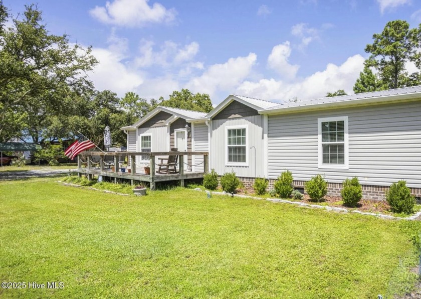 This delightful 3-bedroom, 2-bath home sits on three combined - Beach Home for sale in Shallotte, North Carolina on Beachhouse.com