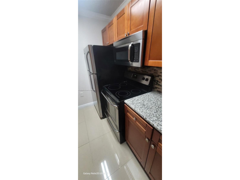 This charming first-floor condo offers a prime location, perfect - Beach Condo for sale in Miami, Florida on Beachhouse.com