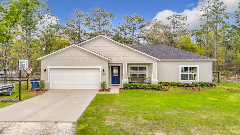 Beautifully designed with striking curb appeal, this home offers - Beach Home for sale in Weeki Wachee, Florida on Beachhouse.com