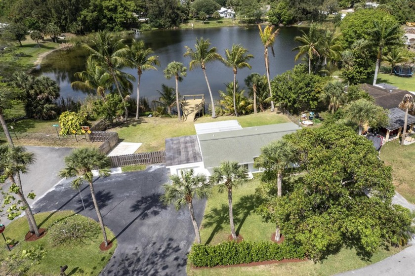 Stunning lakefront views from the brand new dock and backyard of - Beach Home for sale in West Palm Beach, Florida on Beachhouse.com