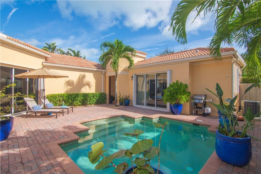 Welcome to this stunning lakefront tropical oasis courtyard home - Beach Home for sale in Vero Beach, Florida on Beachhouse.com