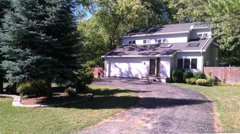 Welcome home to this 2 story vinyl-sided home in Shore Meadows - Beach Home for sale in Angola, New York on Beachhouse.com
