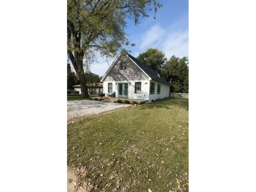 This charming 3-bedroom house, nestled in a peaceful coastal - Beach Home for sale in Lexington, Michigan on Beachhouse.com