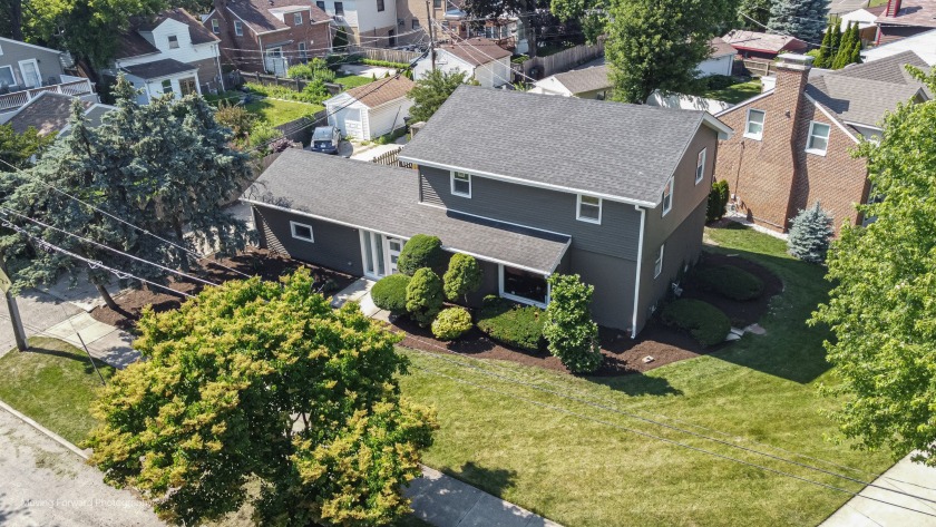 Step into this beautifully reimagined home where classic charm - Beach Home for sale in Skokie, Illinois on Beachhouse.com