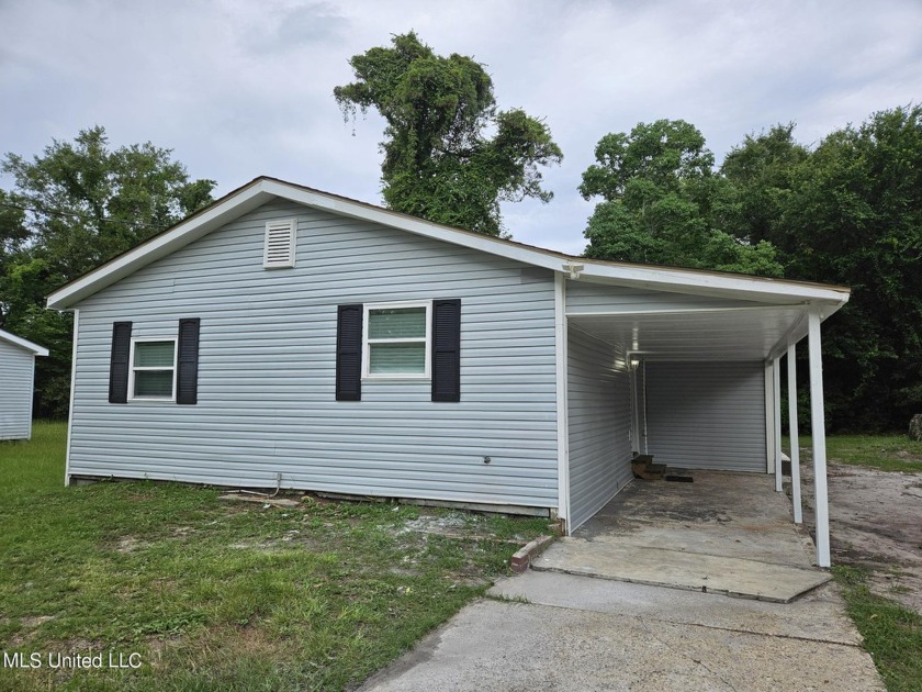 Charming three-bedroom home featuring new paint, new carpet, and - Beach Home for sale in Biloxi, Mississippi on Beachhouse.com