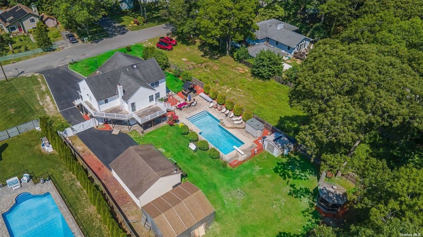 Welcome to this beautifully appointed five-bedroom, 4 1/2 - Beach Home for sale in Shirley, New York on Beachhouse.com