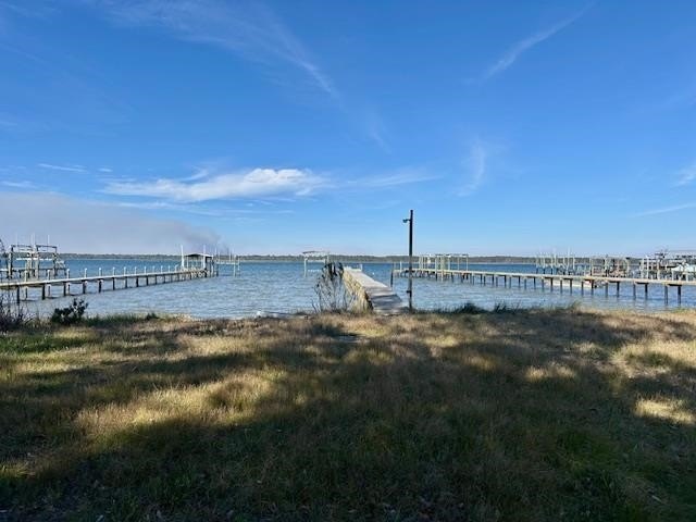 Nestled beneath the pines, the beautifully updated 1942 cottage - Beach Home for sale in Alligator Point, Florida on Beachhouse.com