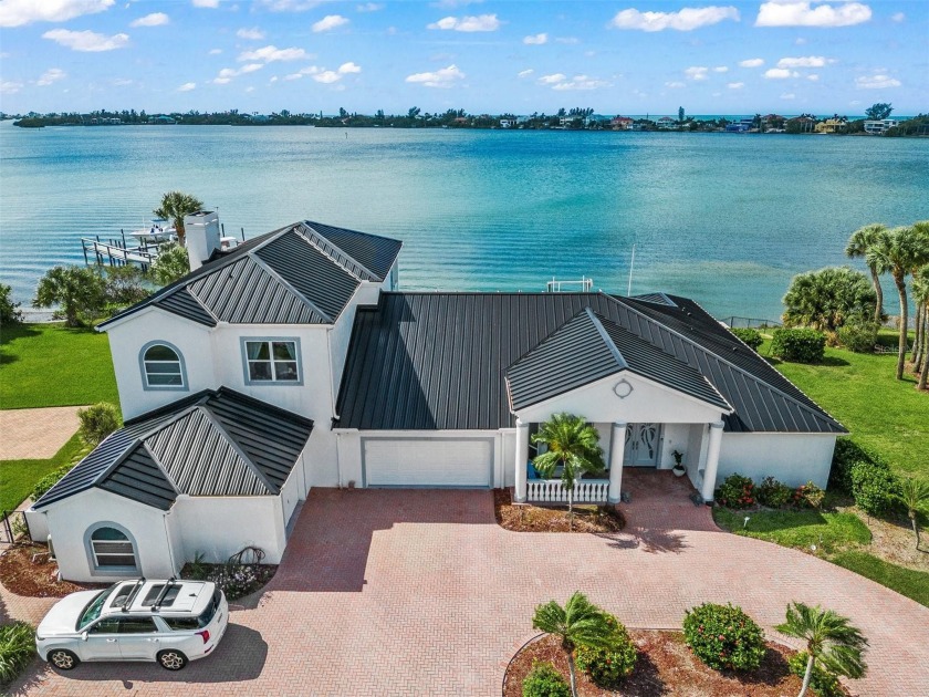 This exceptional island living boasts all the convenience of a - Beach Home for sale in Nokomis, Florida on Beachhouse.com