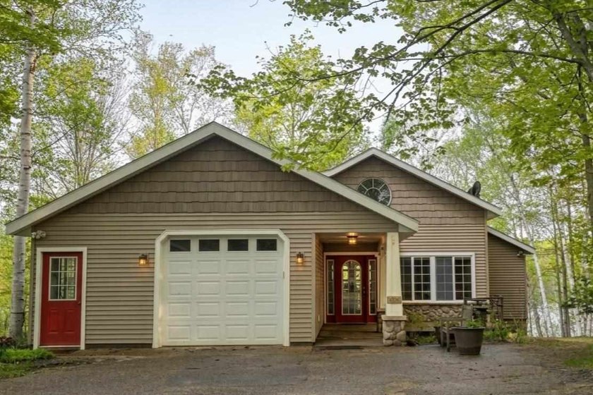 Discover unparalleled tranquility at this stunning waterfront - Beach Home for sale in Charlevoix, Michigan on Beachhouse.com