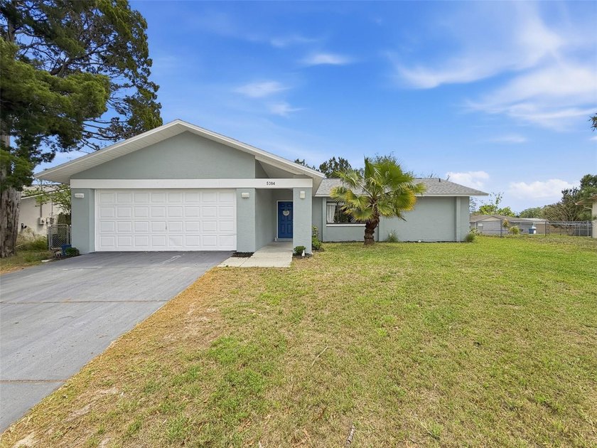Set on nearly a  1/4  acre of land, this affordable, updated - Beach Home for sale in Spring Hill, Florida on Beachhouse.com