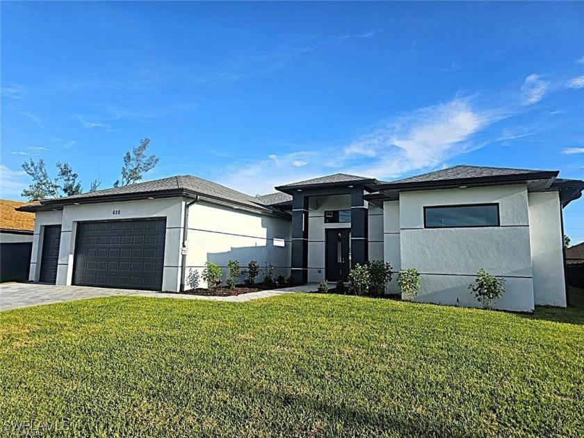 JUST REDUCED! Gorgeous Waterfront Pool Home located in the Heart - Beach Home for sale in Cape Coral, Florida on Beachhouse.com