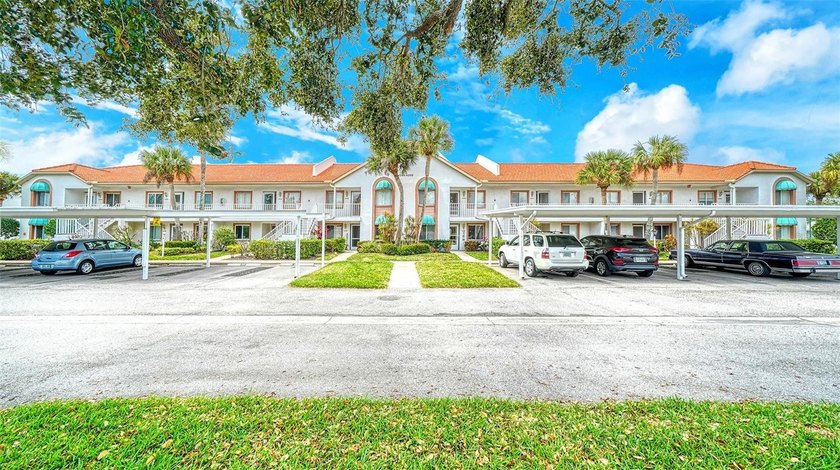 Serene lake views create a peaceful setting for this beautifully - Beach Condo for sale in Sarasota, Florida on Beachhouse.com
