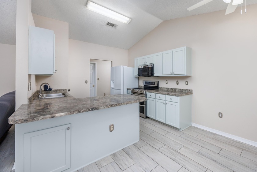 Discover the perfect blend of comfort and coastal living in this - Beach Home for sale in Gulf Breeze, Florida on Beachhouse.com