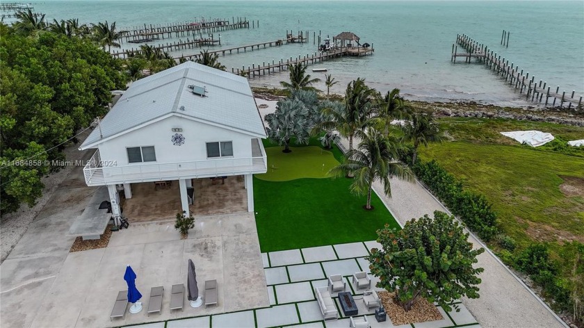 Discover your dream retreat in this beautiful oceanfront home - Beach Home for sale in Plantation Key, Florida on Beachhouse.com