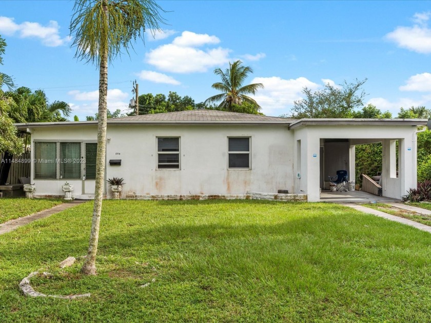 (LOCATION, LOCATION: PRICED TO SELL): This semi-remodeled home - Beach Home for sale in North Miami Beach, Florida on Beachhouse.com