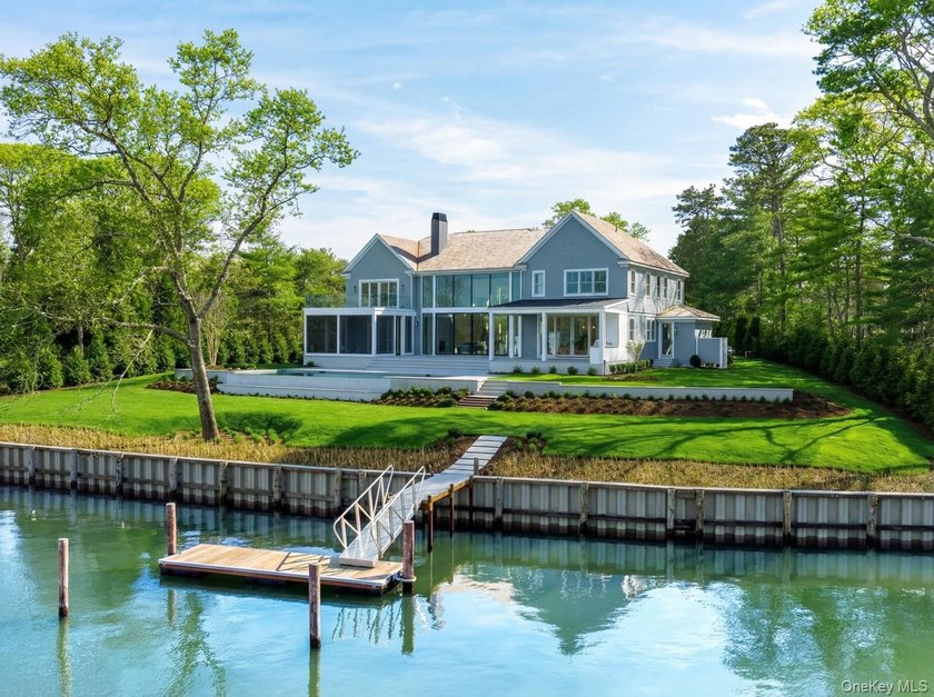 Positioned on a prime stretch of waterfront in Quogue, this - Beach Home for sale in Quogue, New York on Beachhouse.com