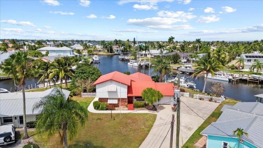 Prime Waterfront Corner Lot with Endless Potential in Seagate - Beach Home for sale in Palm City, Florida on Beachhouse.com